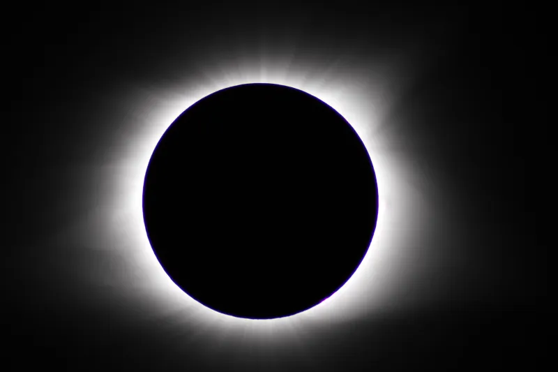 A total solar eclipse with the sun completely blocked and only a halo visible