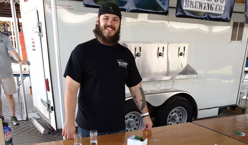Big Tupper Brewing's Brewer Rick LaFlamme serves of some IPA "Eh" Ale at the Saratoga Brewfest in June.