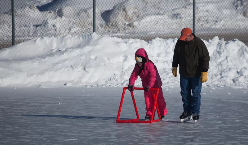 Learning to skate on the outdoor rink at the Tupper Lake Municipal Park.