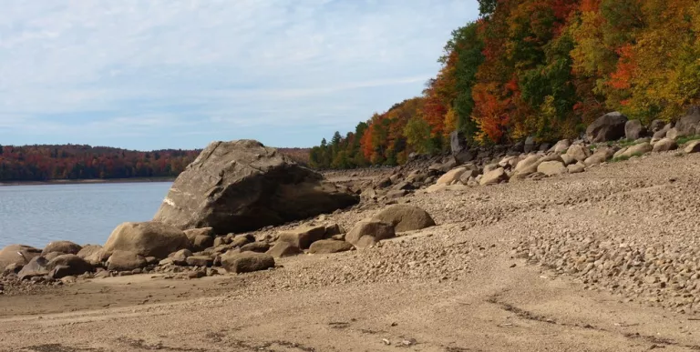 The sandy shores of Carry Falls makes a nice contrast with fall foliage.
