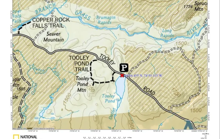 A map showing a road&#44; parking area&#44; and some trails
