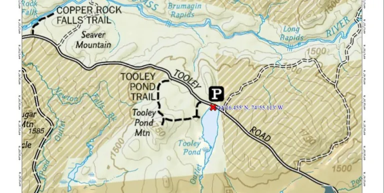 A map showing a road&#44; parking area&#44; and some trails