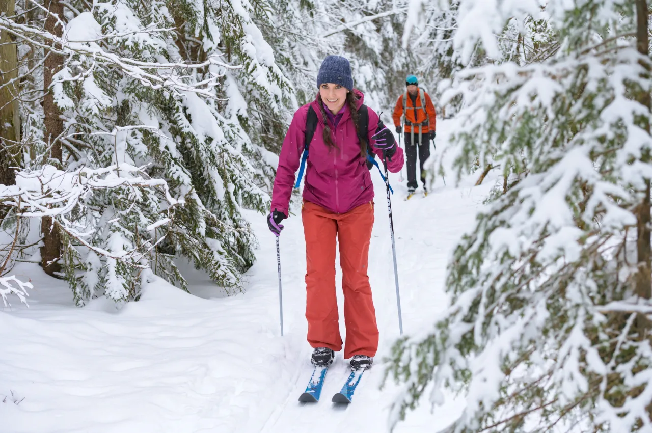 A woman cross-country skiing.