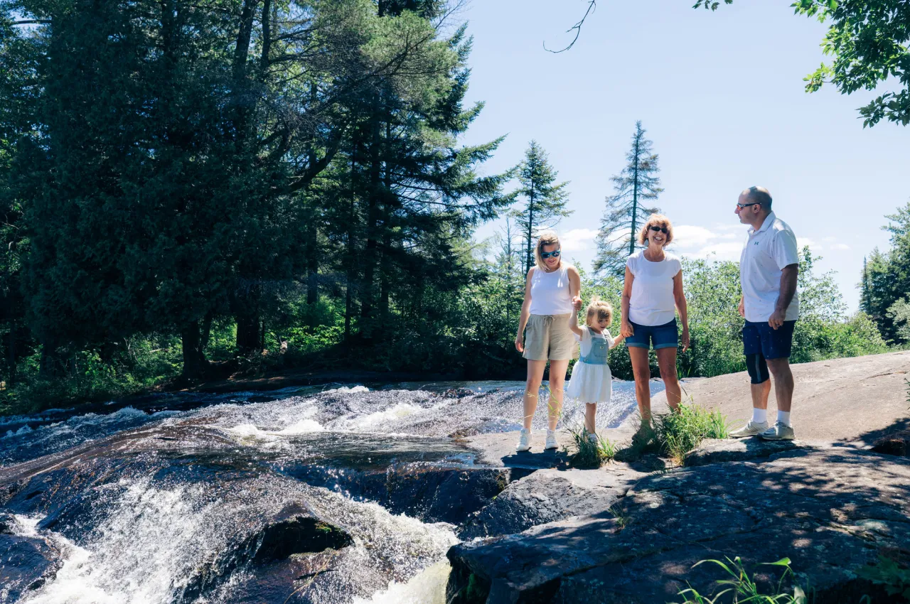 A family on a waterfall hike.