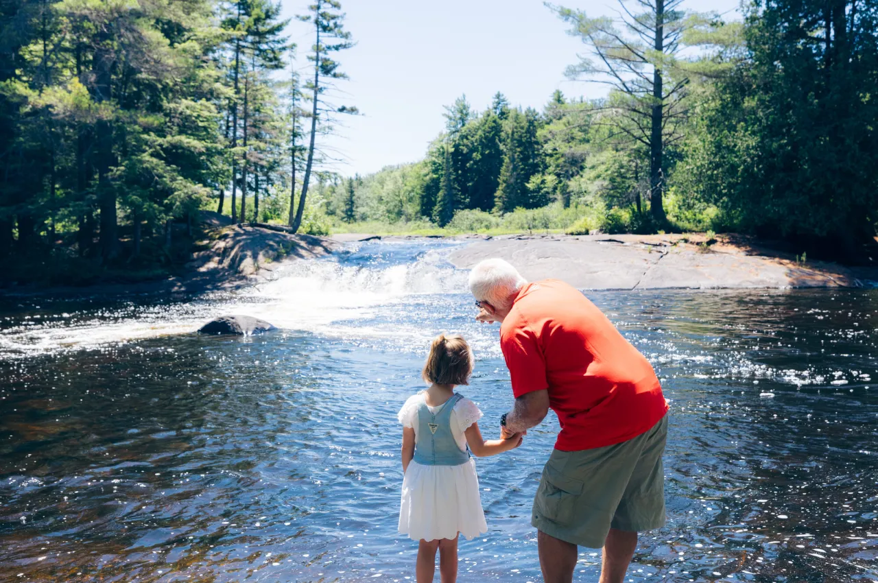 A family at a waterfall.