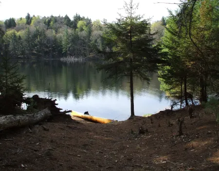 The tranquil waters of Little Tupper Lake beckon the paddler