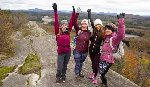 A joyous group celebrates their summit of Lows Overlook.