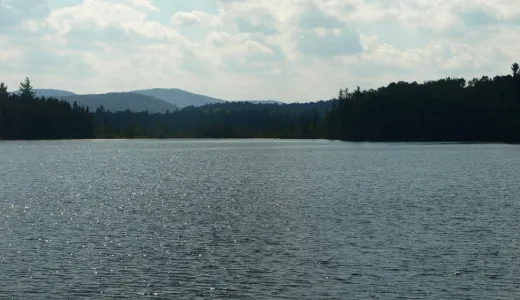 A medium-sized pond with mountain views