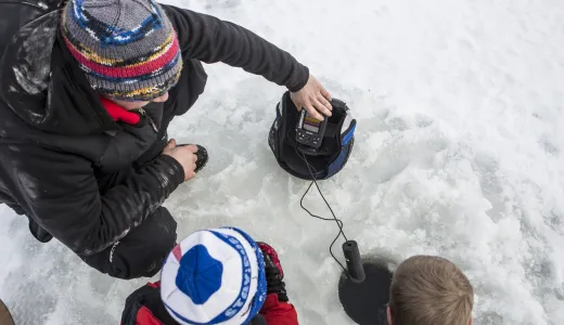 A family ice fishes