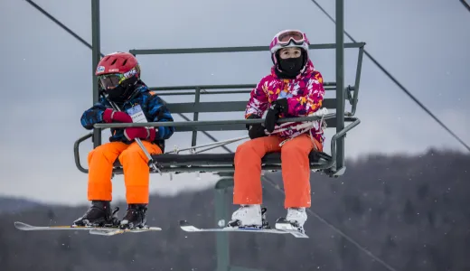 Two kids on a chair lift at Titus
