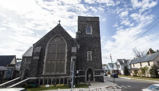 Exterior of the tall grey stone church