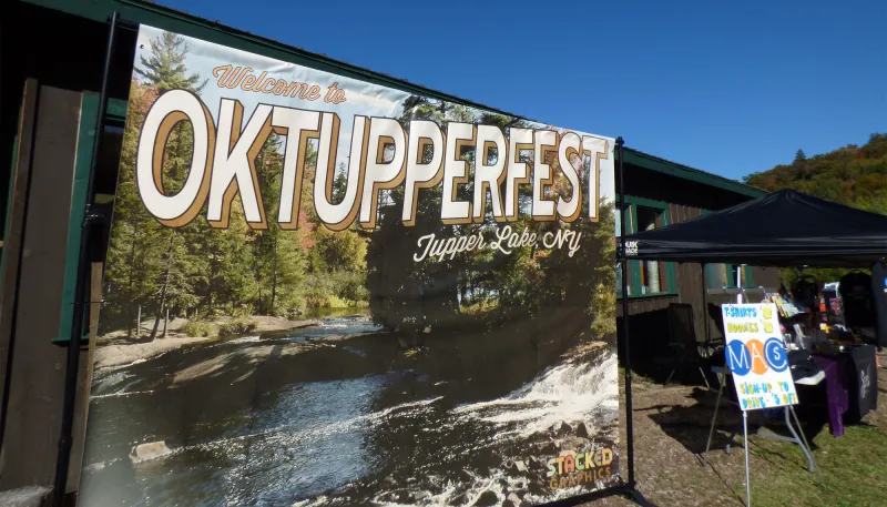 A postcard-style banner advertises OkTUPPERfest on a sunny day.