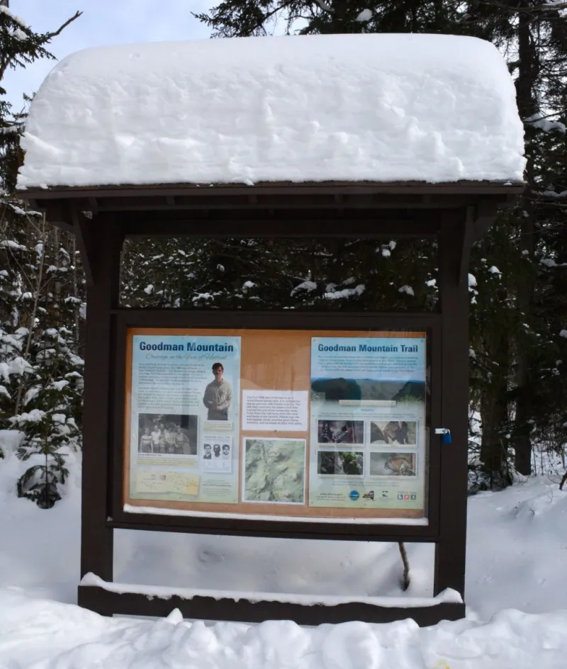 The informational display detailing the life of Mr. Andrew Goodman at the trail register of Goodman Mountain