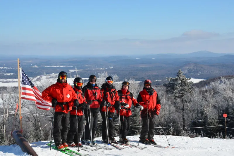 Member of the Big Tupper Ski Patrol, from left, Adam Hurteau, Mitch Harriman, Anne Maltais, Ted Merrihew, Charlie Hoffer, and Phil Jones, take a break at the top of Chair 2 for a group shot