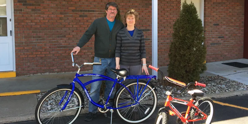 Terrance & Robyn Doolen, owners of Shaheen's Adirondack Inn, stand next to two of their new "house bikes."