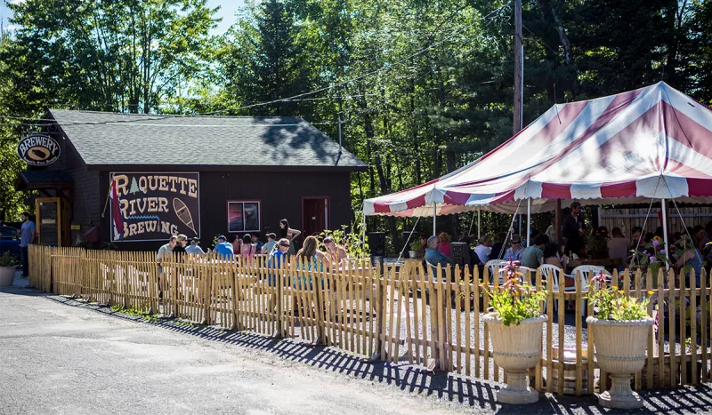 Crowds gather in the beer garden at Raquette River Brewing.