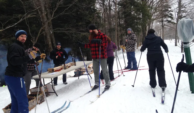 Skiers sample on the trails of the Tupper Lake Groomed Cross Country Ski Center during the 2015 Brew-Ski (ROOST/Jess Collier photo)