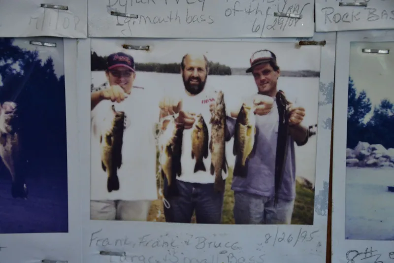 Frank Scotti, center, and his son Frank, left, and Bruce, right, showing off their catches of the day in a photo taken in 1995 that hangs on the Blue Jay Campsite store wall.
