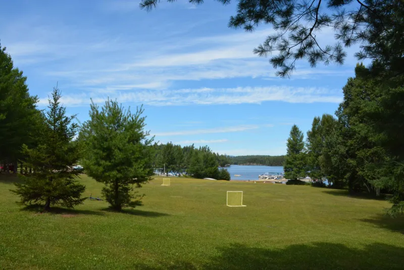 The Blue Jay Campsite property includes a beautiful stretch of lawn that leads down to the sandy beach.