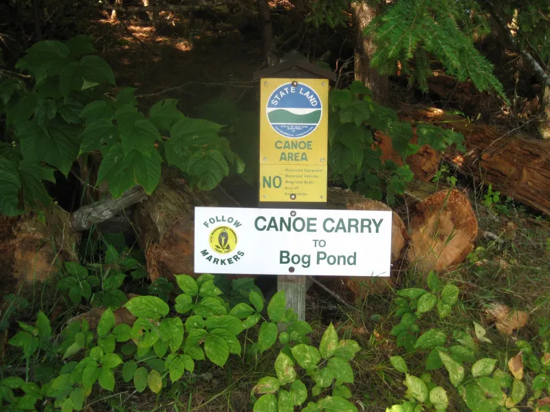 The portage sign for Bog Pond.