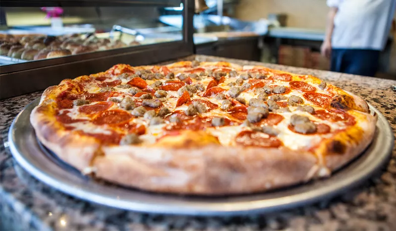 Little Italy Pizza - Watch the game at the bar or order take-out and watch it back at the room.