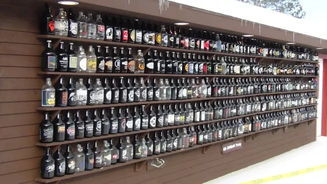 A display of growlers from craft brewers from all over the world, donated by brewery fans.
