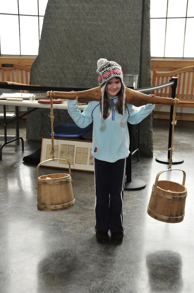 Historically authentic pails and yokes help children understand how we get maple syrup to our flapjacks.