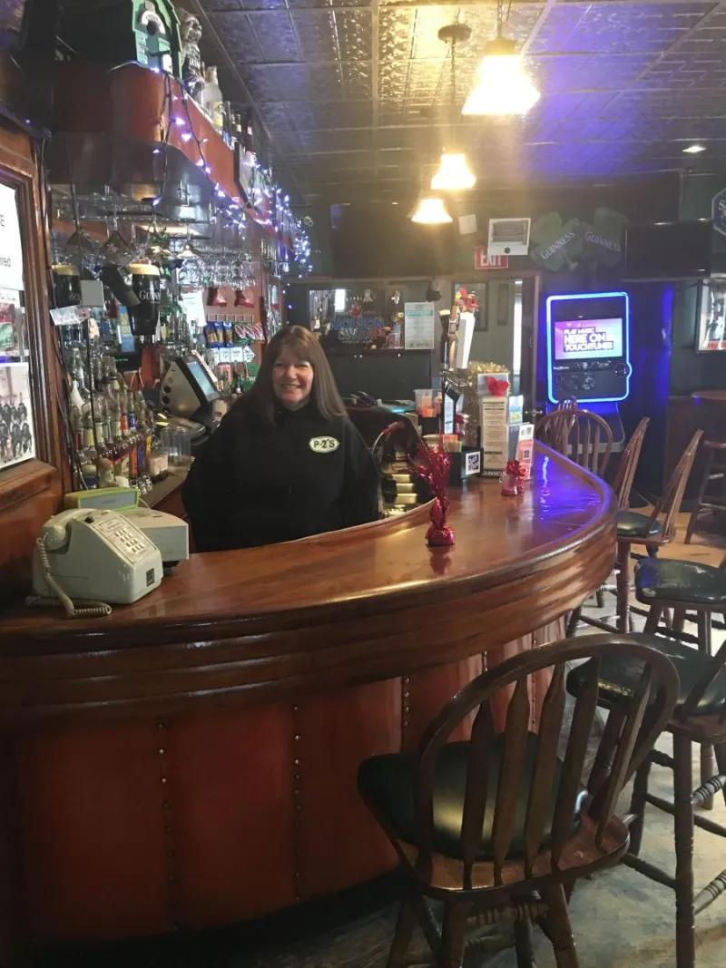 P-2's daughter Michelle, behind the bar.