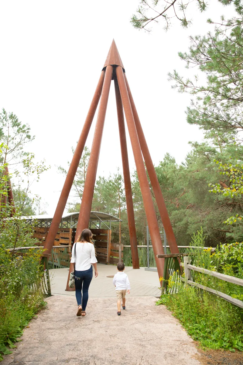 A woman and toddler entering The Wild Walk.