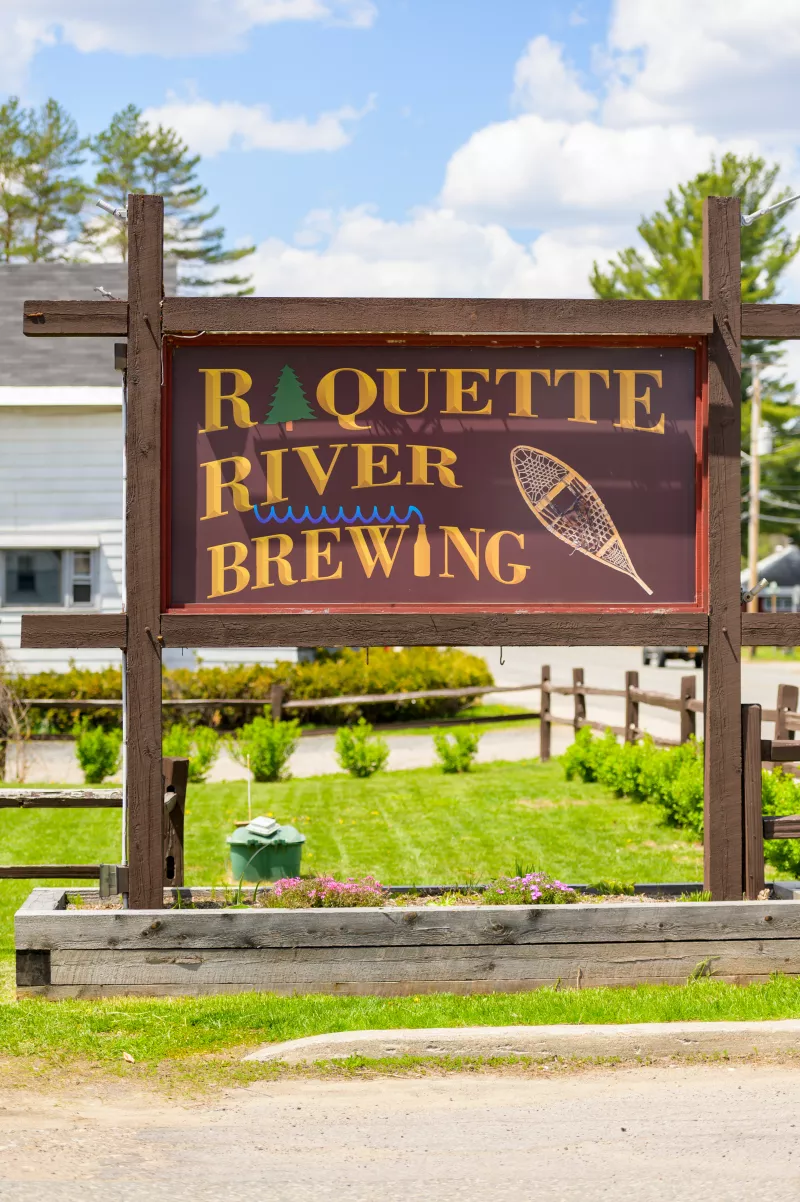 The entrance sign for Raquette River Brewing