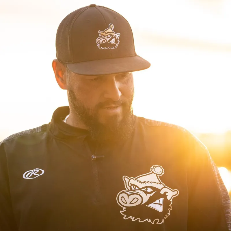 A River Pigs team member with the setting sun behind him.