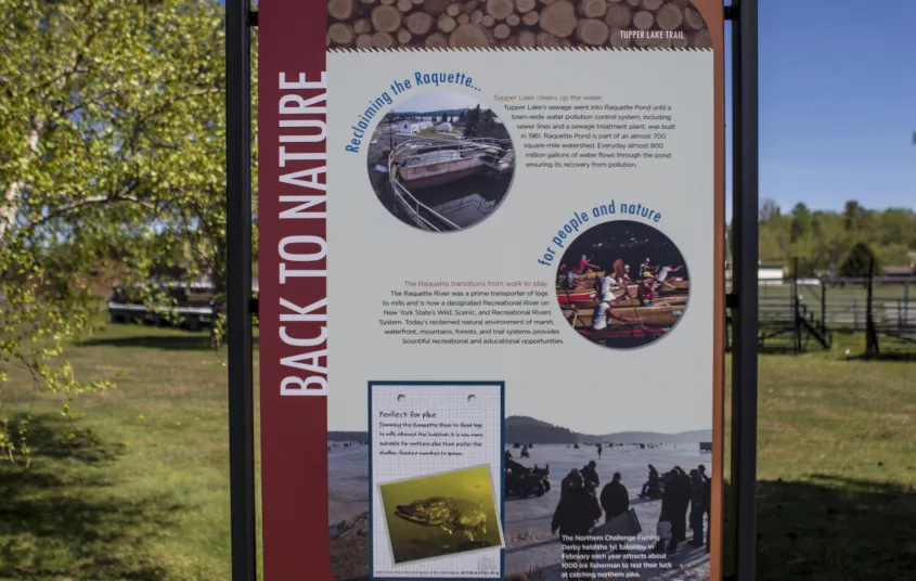 Flander's Waterfront Walkway has interpretive stations about Tupper Lake.