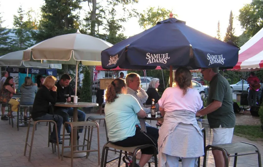 Tables outside with large umbrellas
