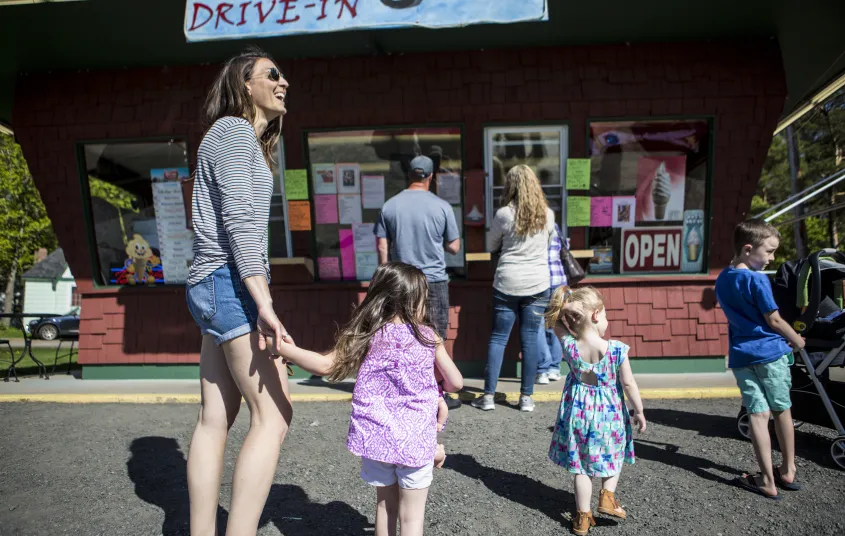 A family stands in line to get ice crea