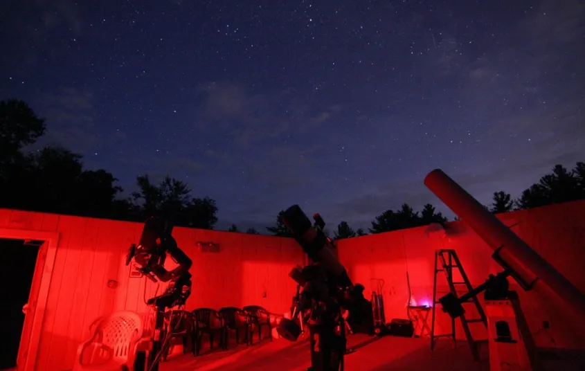 Astronomy equipment glowing with red light