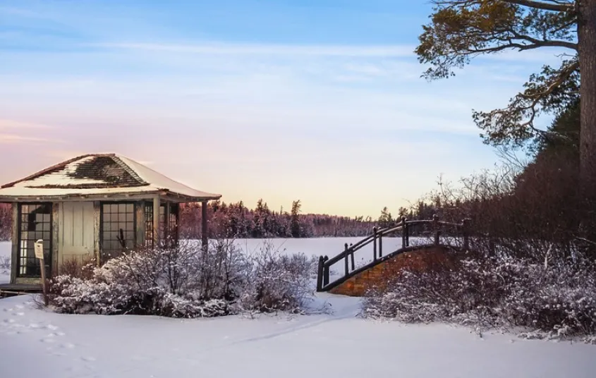 Looking through the window at white whicker furniture