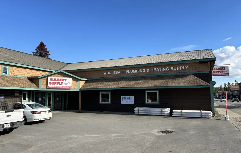 A brown building with shake roof.
