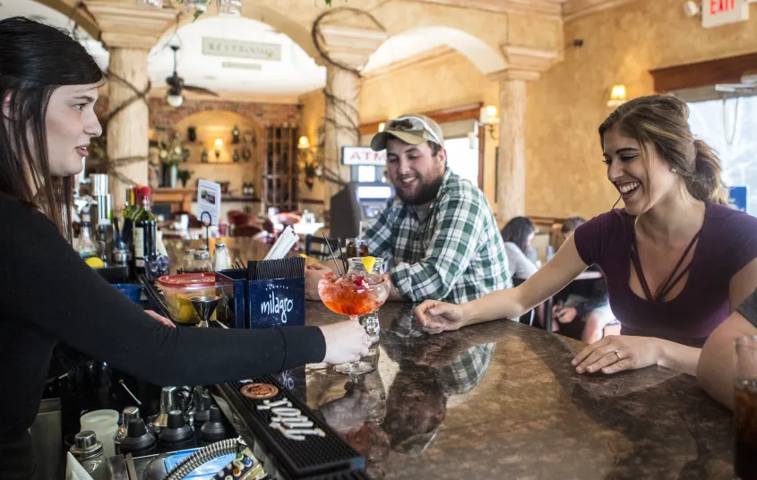 Happy people at the bar