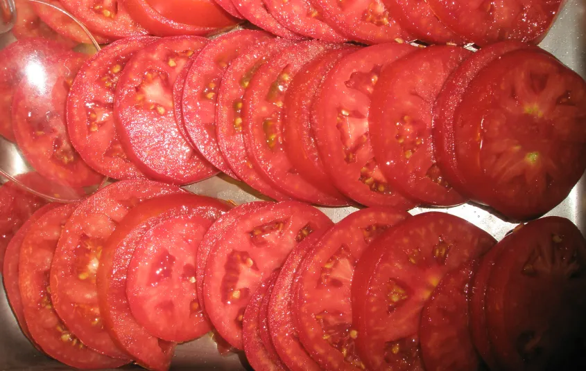 Perfectly ripe red sliced tomatoes.