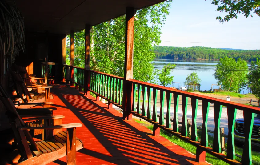A large covered porch overlooking the lake
