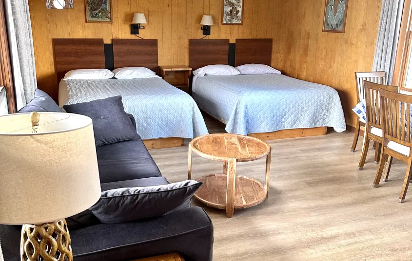 A two queen room with lamp