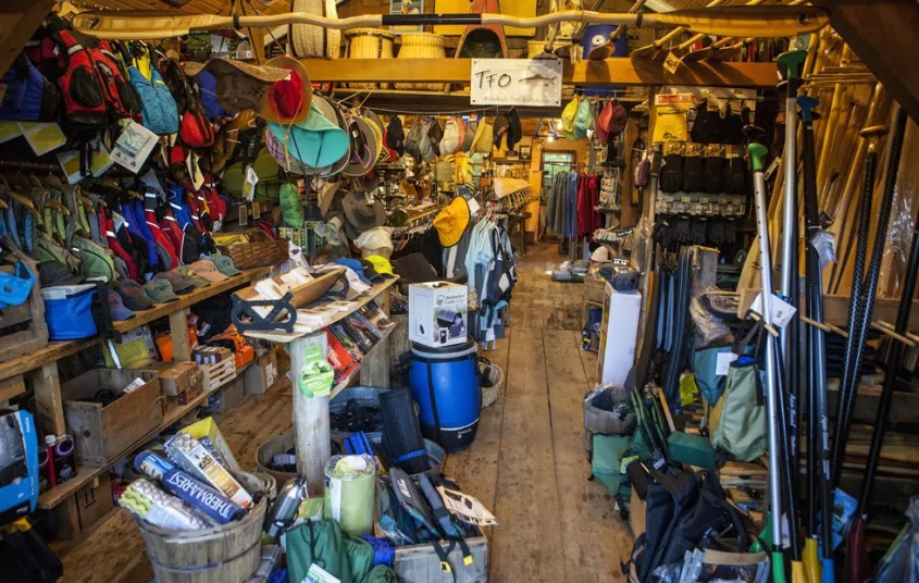 Shelves packed with colorful adventure gear.