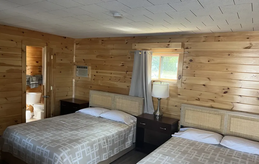 Looking in a a two bed room at The Tupper Lake Motel.