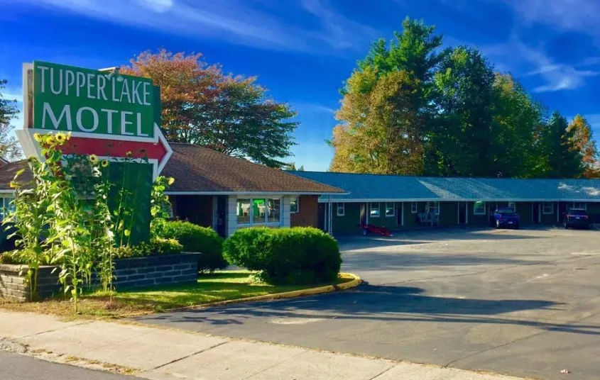 Entry way to the Tupper Lake Motel and the parking area.