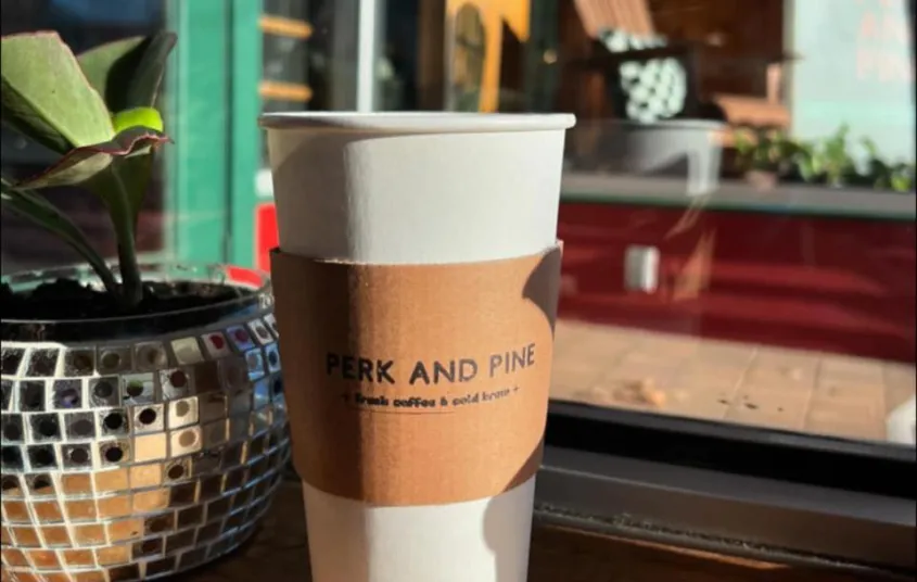  walls full of shelves with shirts and sweatshirts