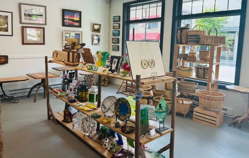 Various art medium on display shelves.