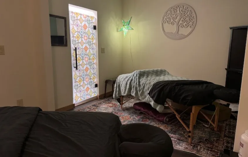 A treatment room with two beds for couples massages.