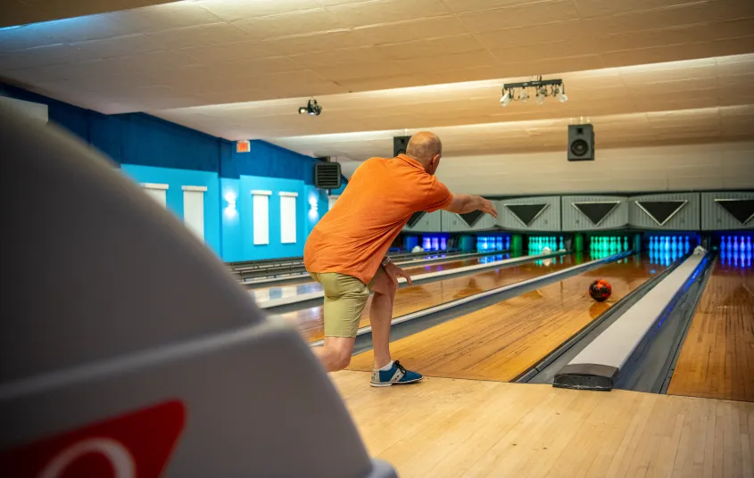 A man bowls.