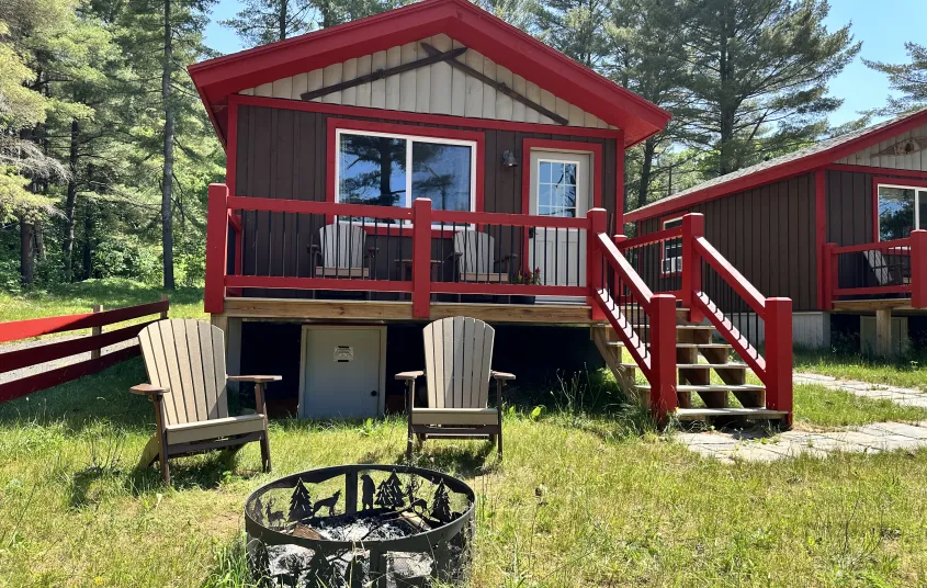 Exterior of cabin with Red trim and brown siding