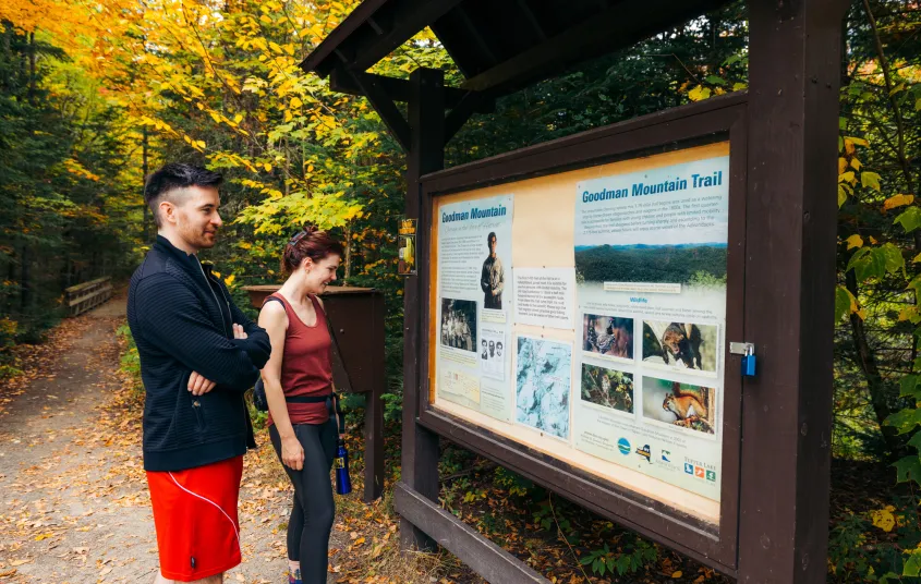 A couple learning about Goodman Mountain's namesake